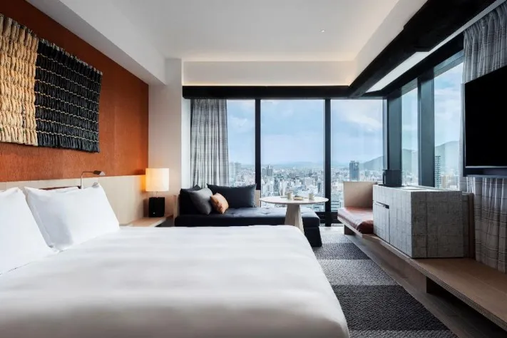 A spacious deluxe room located in a corner.